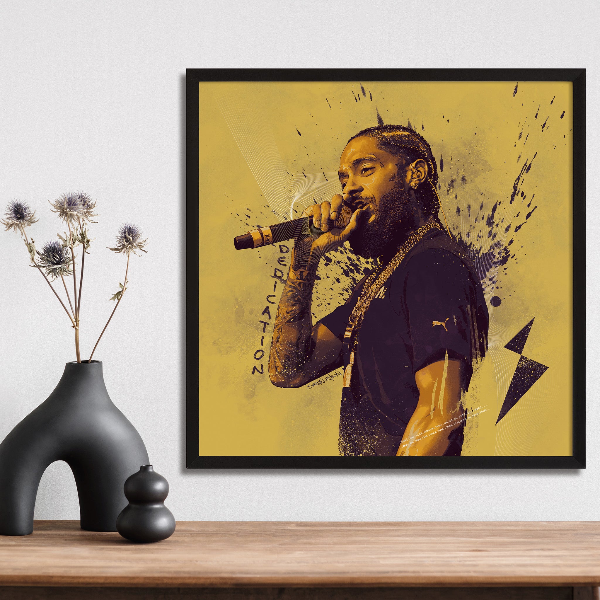 "Nipsey Hussle illustrated poster with black border on shelf — black culture wall art print"